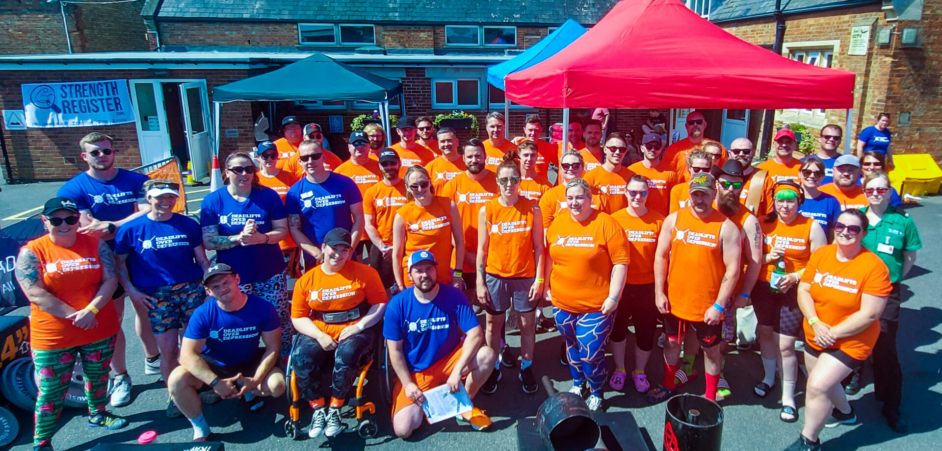 buds fitness deadlifts over depression pose for group photo