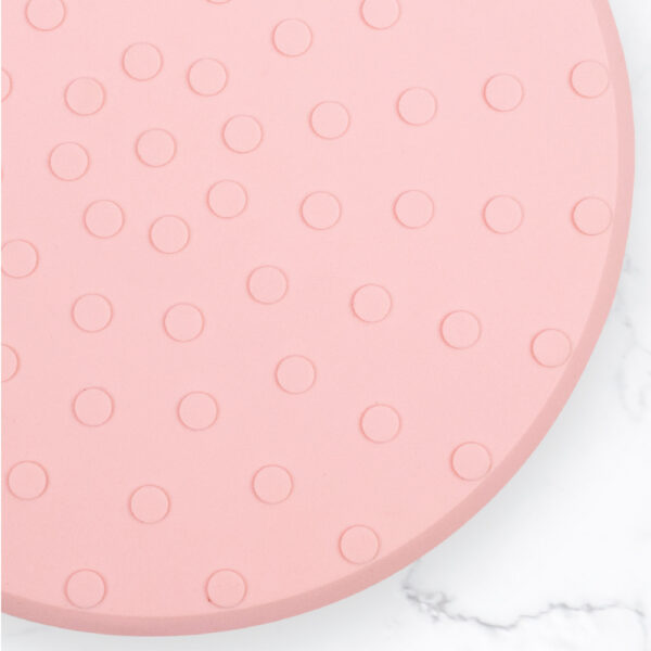 Underside of the pink silicon jelly cushion showcasing the debossed grippy dots
