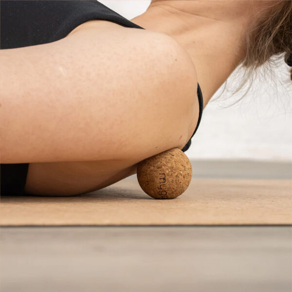 5cm Cork Massage ball being used on the shoulder