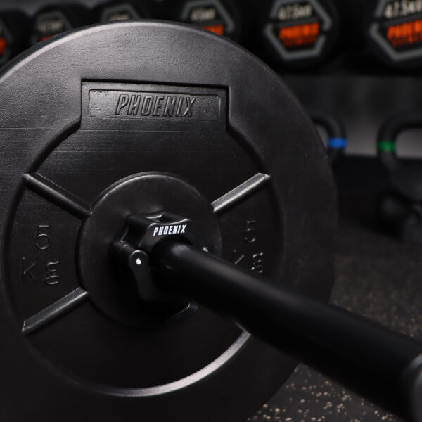 A lifestyle image of the 1 inch black barbell collar on a black standard bar