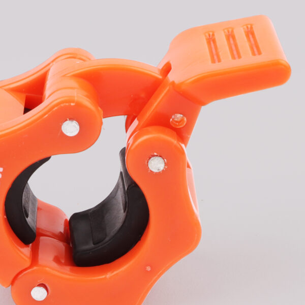 Photo of open 1 inch orange barbell collar