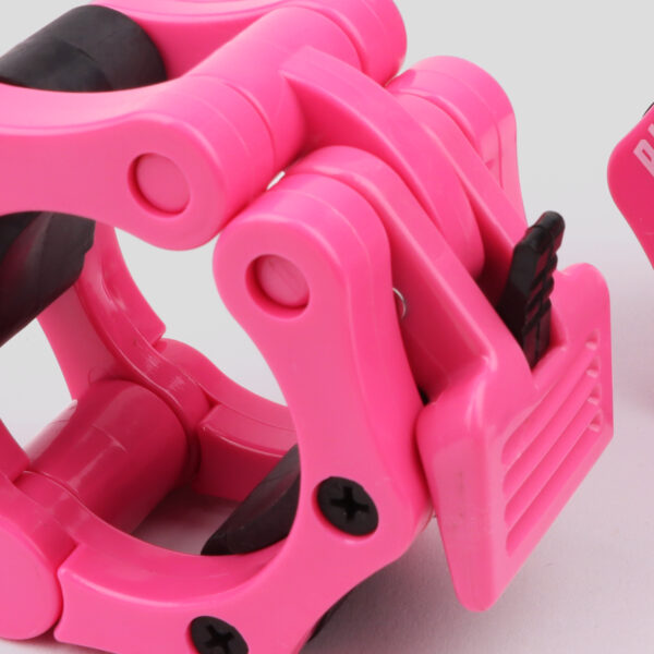 Close up of the pink phoenix fitness barbell collar, and it's sturdy quick release clip