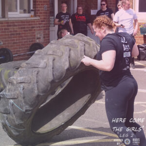 Jade Osman taking a joint 1st place on the tyre flip event.
