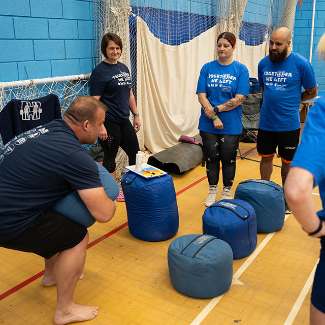 Keoghan and Clara of Strength Register showing just how to use the Strength Register Sandbags